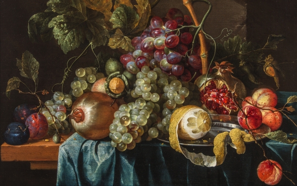 A Still Life of Fruit on a wooden Table, partly covered by a blue Tablecloth, with a half-peeled Lemon on a pewter Dish, surrounded by Bunches of Grapes, Plums, Apricots, Walnuts and Hazelnuts by Jan Davidsz de Heem 
